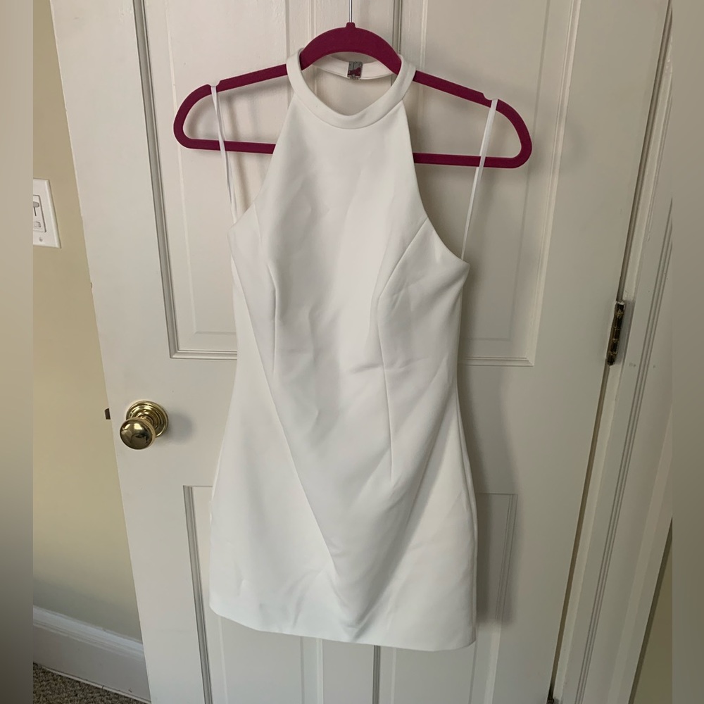 NWT Halston size 6 white halter mini dress. Never worn!!